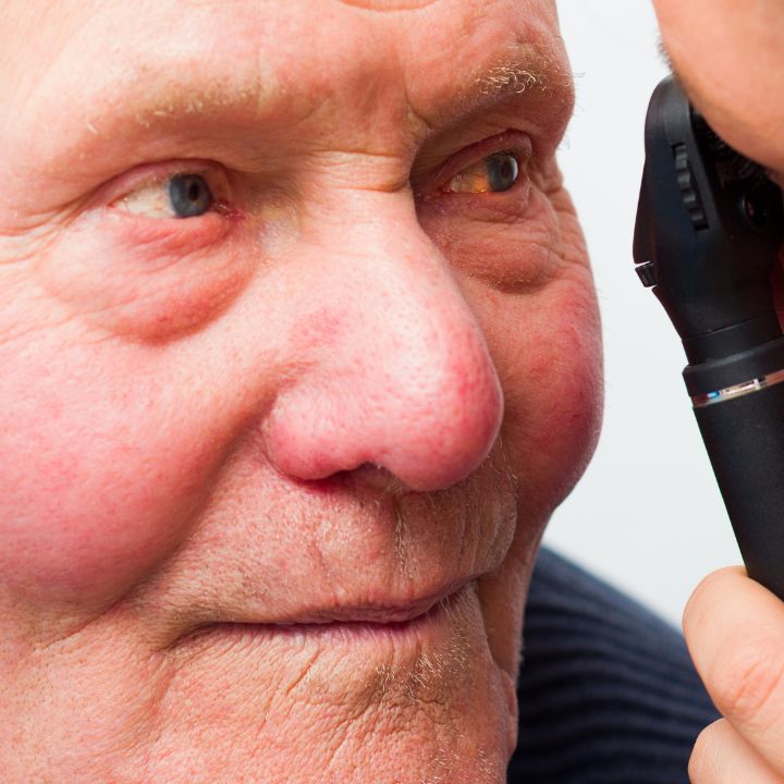 Senior man getting eye exam